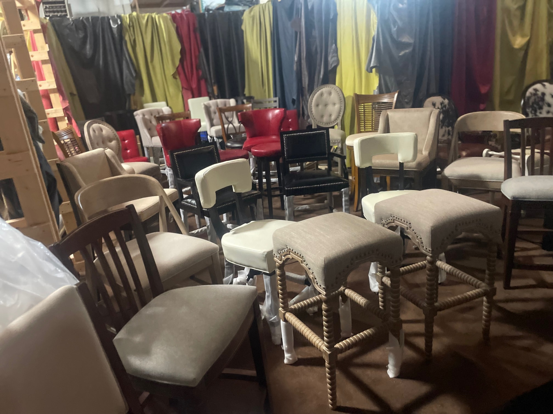 Rows of upholstered chairs and bar stools inside the J&S showroom on Avon Ave